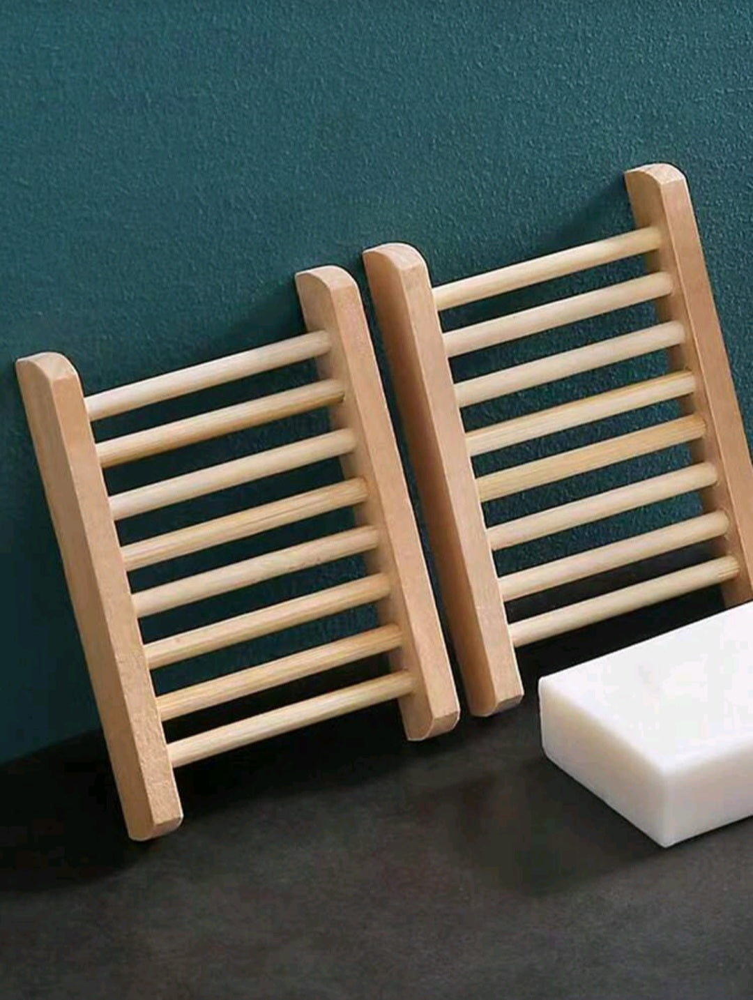 Apricot bamboo soap tray holding a bar of soap, eco-friendly and stylish bathroom accessory