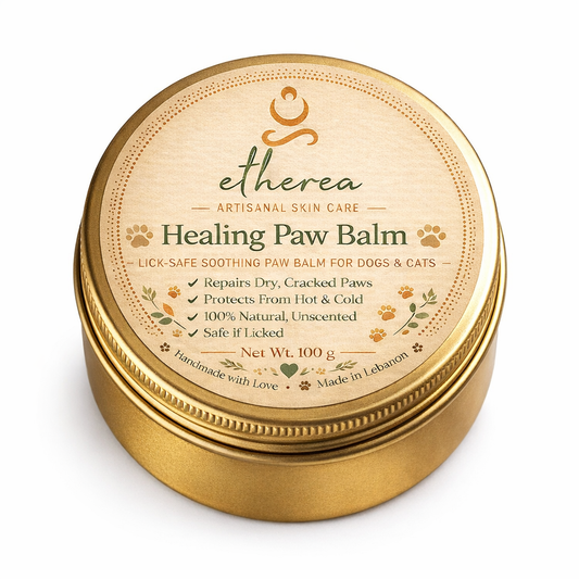 Natural lick-safe paw balm by Etherea for dogs and cats, packaged in a round gold tin with elegant label.